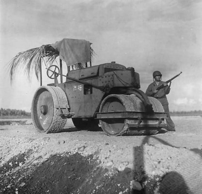 Marine_guards_a_captured_Japanese_steamroller_at_airfield_on_Guadalcanal_1942.jpg