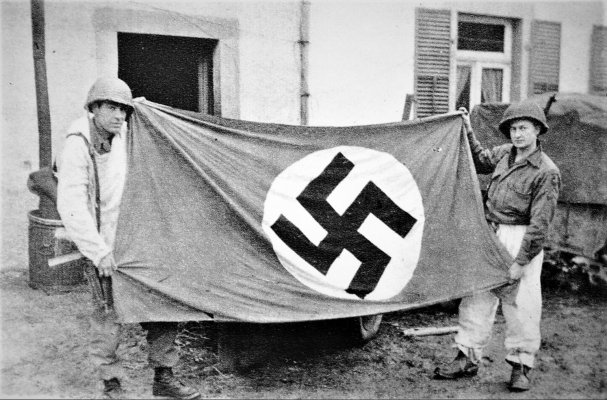 Battle of the Bulge - these two soldiers of the Recon. Platoon show a german trophy.jpg