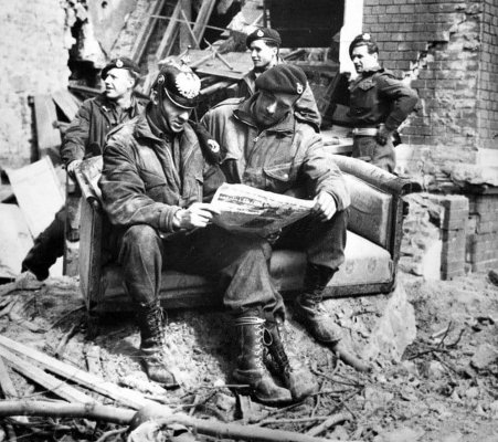British commandos of the 1st Special Service Brigade reading a newspaper after taking Wesel, Ger.jpg