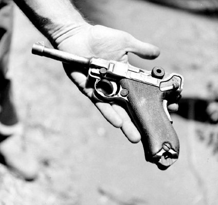 U.S. Marine holds a Luger he captured.jpg